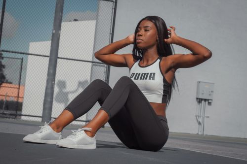 Athletic woman in sportswear exercising outdoors on a sunny day in Tampa, Florida.